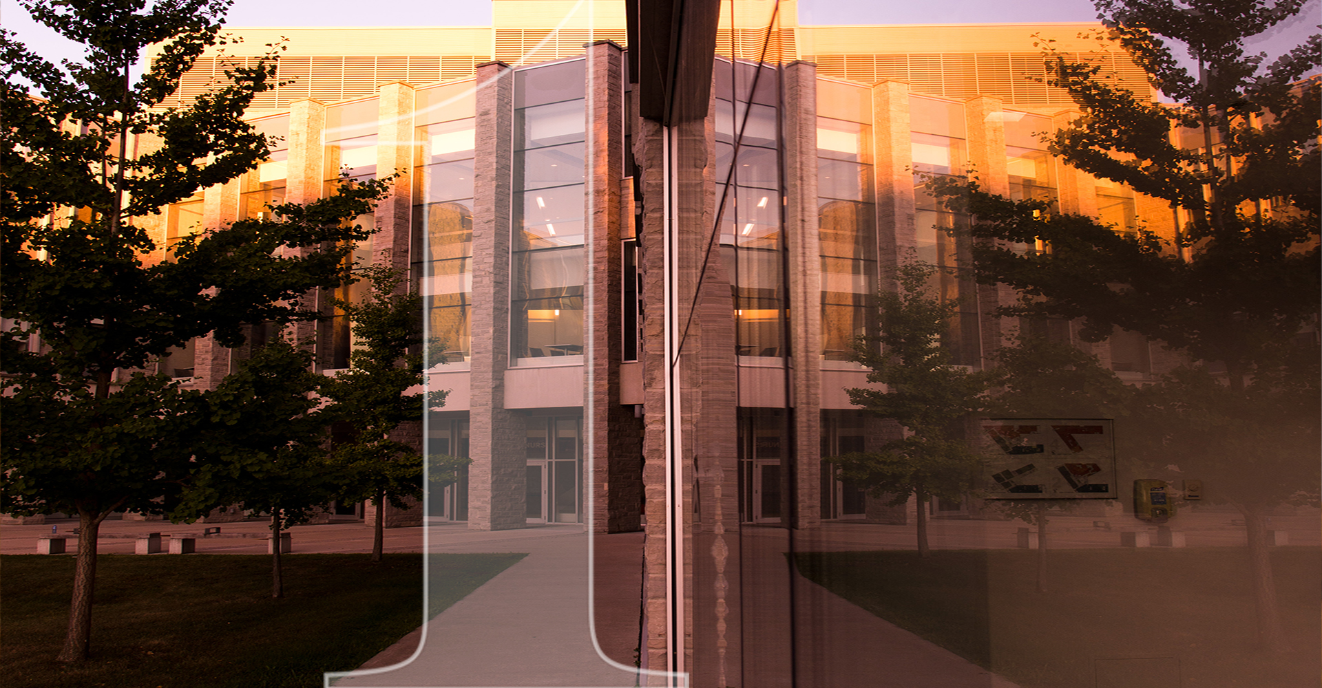 FIMS and Nursing building reflection in glass