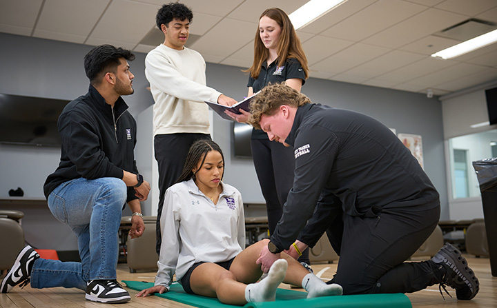 A student having her leg checked.