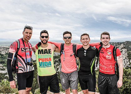 Students standing side-by-side in the outdoors.
