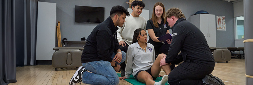 A student having her leg checked.