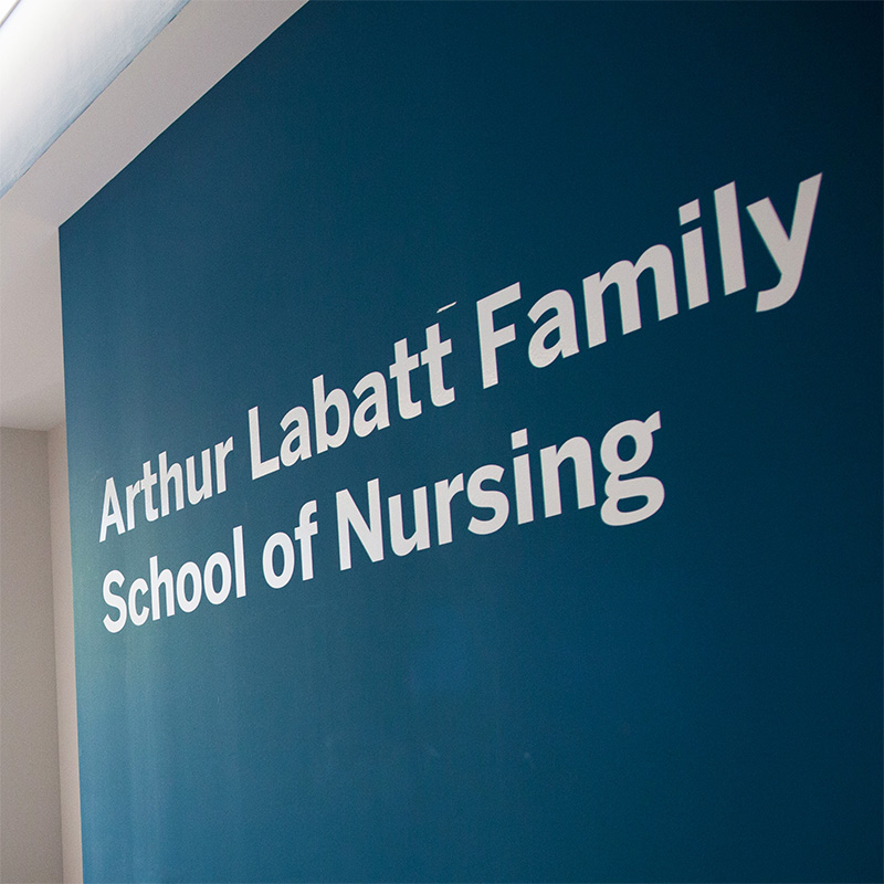 Interior view of the FIMS and Nursing building, showcasing a wall that says "Arthur Labatt Family School of Nursing."