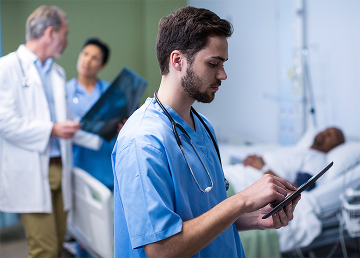 Medical professionals reviewing a Patient's information.