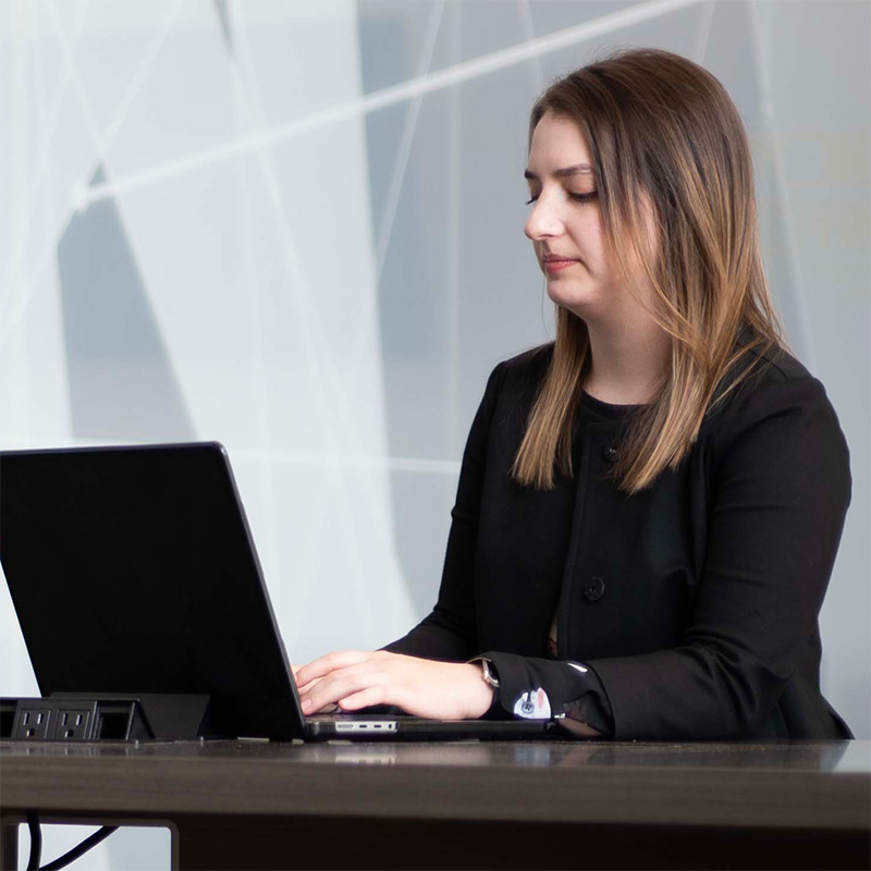 A nursing graduate student studying on their laptop.
