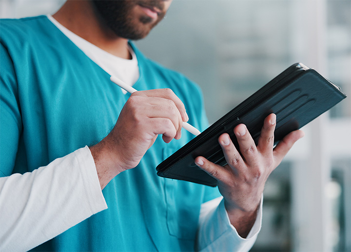 A healthcare professional taking notes.