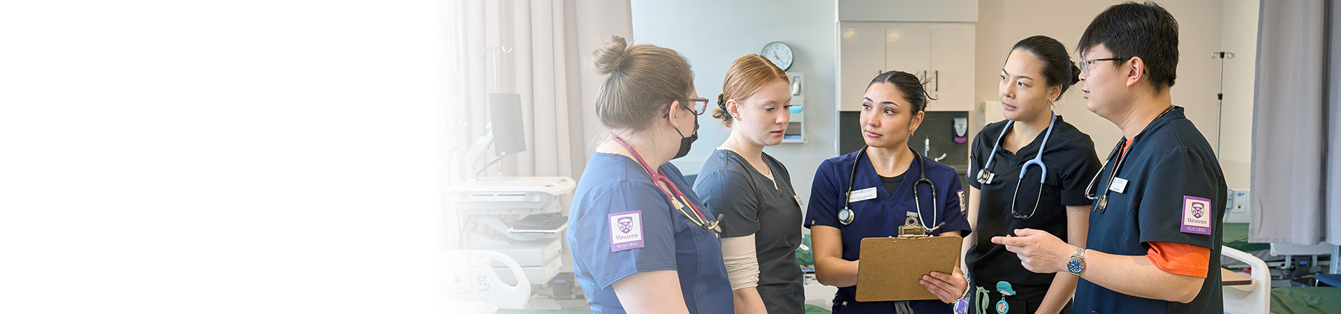 Nursing students discussing notes together.