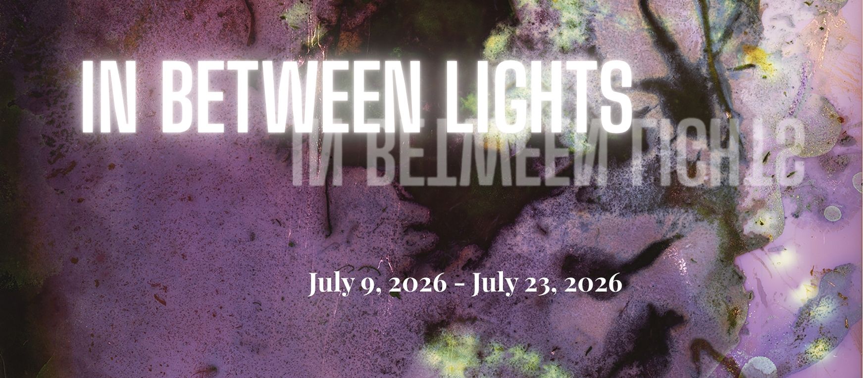 title: in between lights with a hazy purple background
