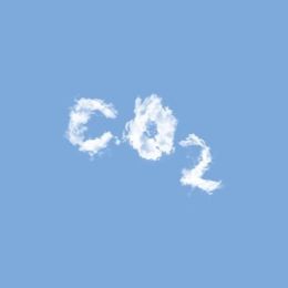 The word CO2 set against a blue sky