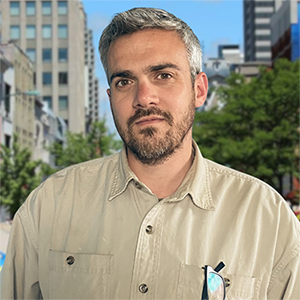 A portrait of Ryan Craven on a city street