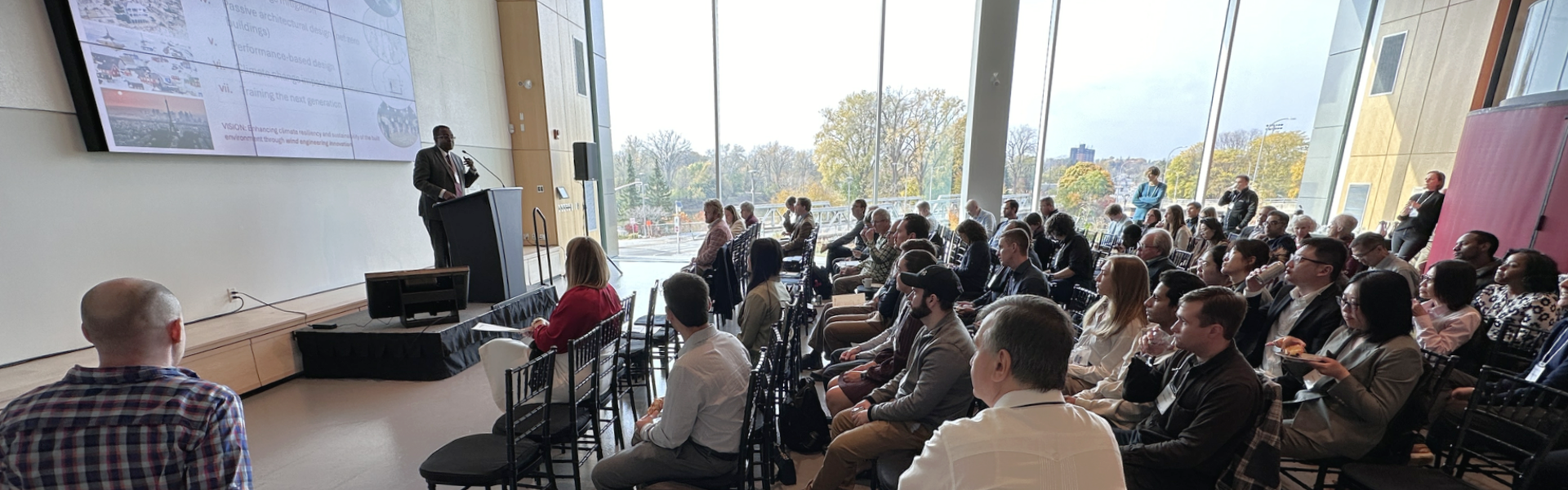 Speaker and audience at symposium