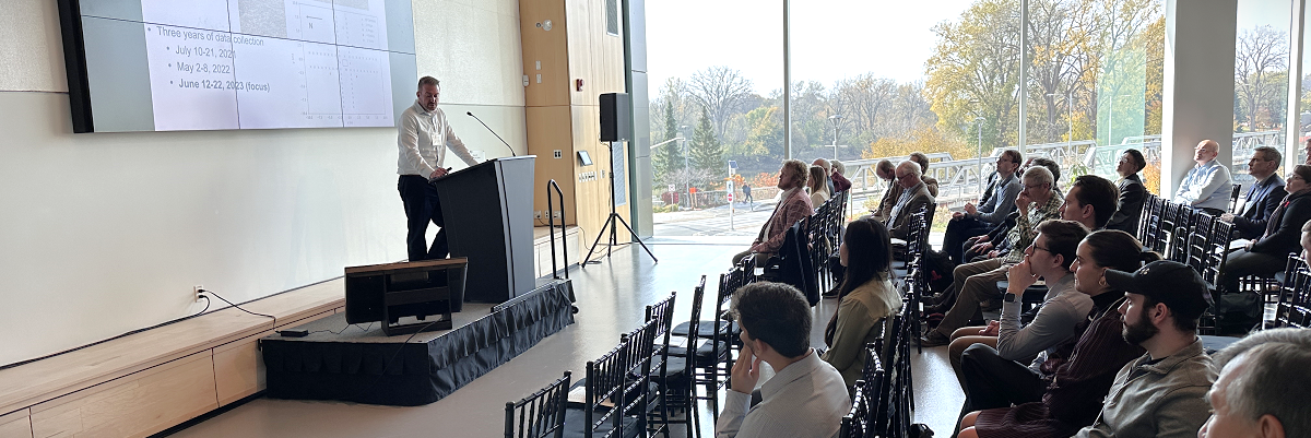 Speaker and audience at CSSL Symposium