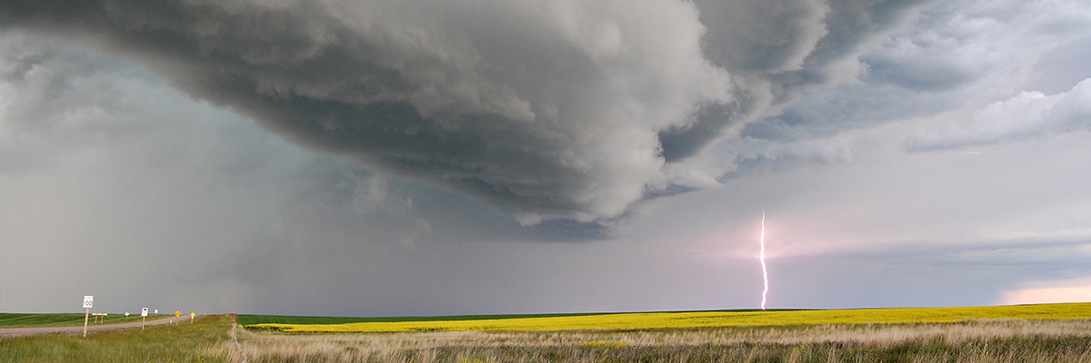 storm clouds and lightning over field