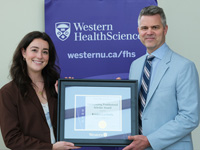 Postdoctoral Awards: 2025 Winner Kristen Lucibello received award from Dean Shaun Boe