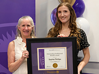 Postdoctoral Awards: Sophie receives her award from Jayne