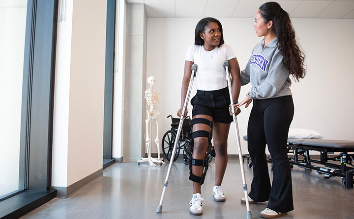 A Physical Therapy student assisting someone with their injury.