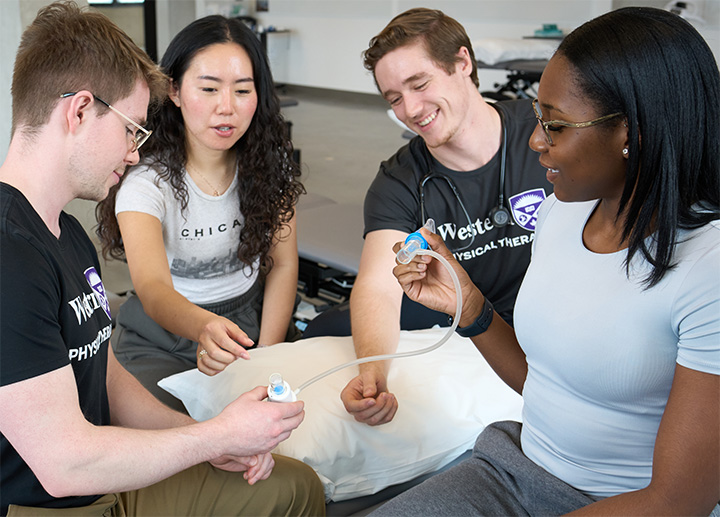 Physical Therapy students learning about medical tools.