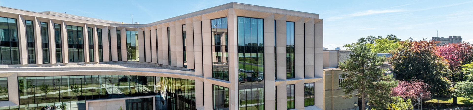 Exterior of the (Ronald D.) Schmeichel Entrepreneurship and Innovation Building (SEI) on a sunny day.
