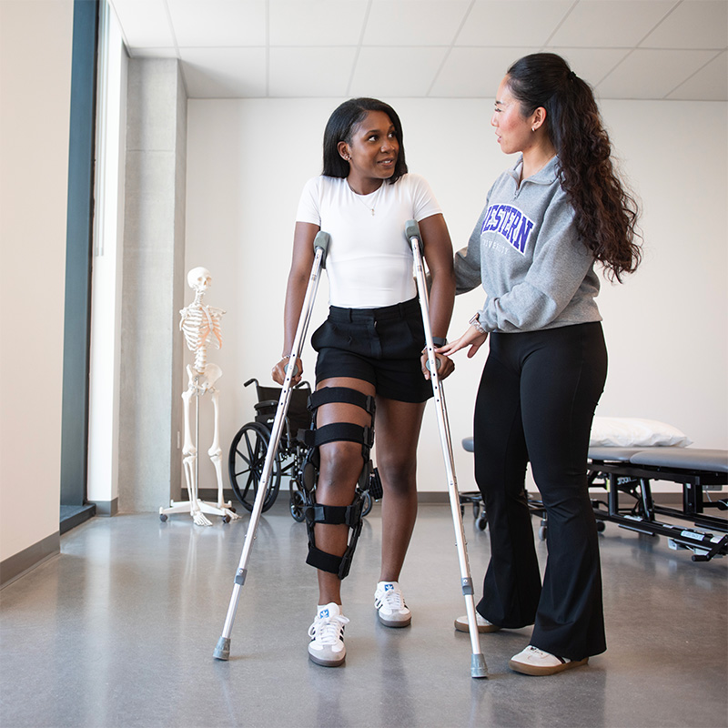 A Physical Therapy students assisting someone with their injury.