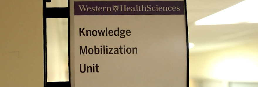 Image of a small hallway sign that says "Knowledge Mobilization Unit"