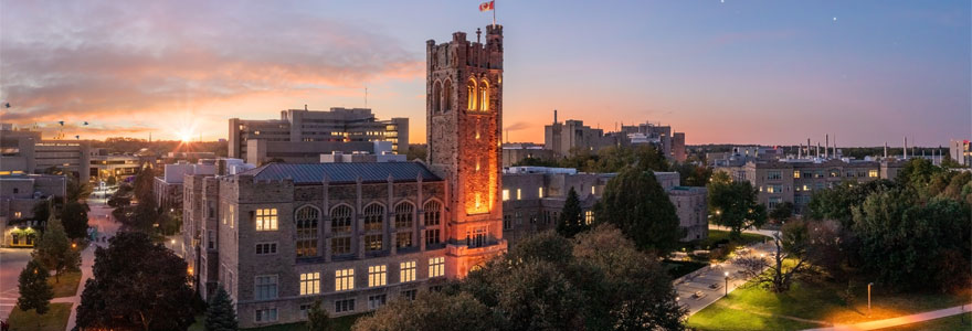 Aerial of UC with the sunsetting behind it.