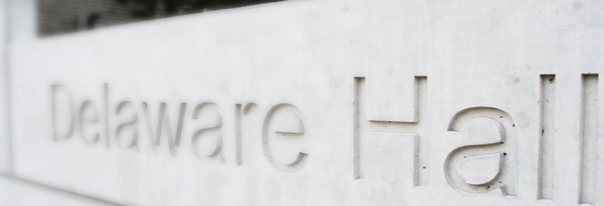 exterior of building focus on the concrete name plate