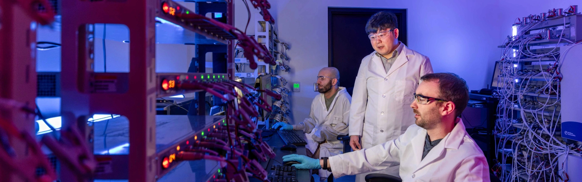 Image of postdoctoral scholars in a computer lab.
