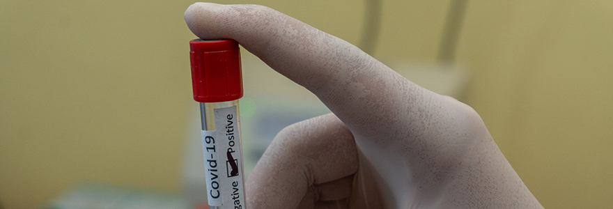 Decorative image of a vial describing a positive blood test for COVID-19.