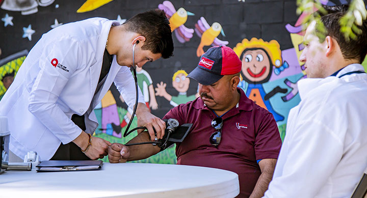 Late middle-aged man getting his blood pressure taken