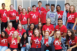 Group photo of incoming class of 2021 in red shirts