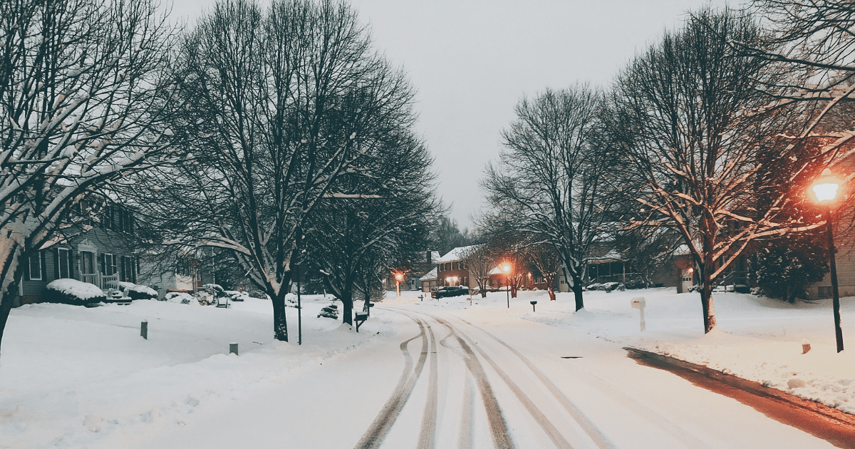 A quiet neighbourhood street covered in snow