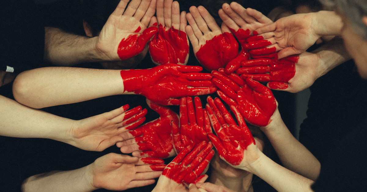 a photo of hands together forming a heart shape