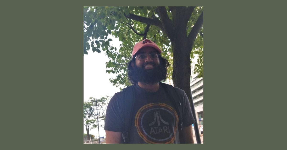 A photo of student, Joshua Mootilal standing outside