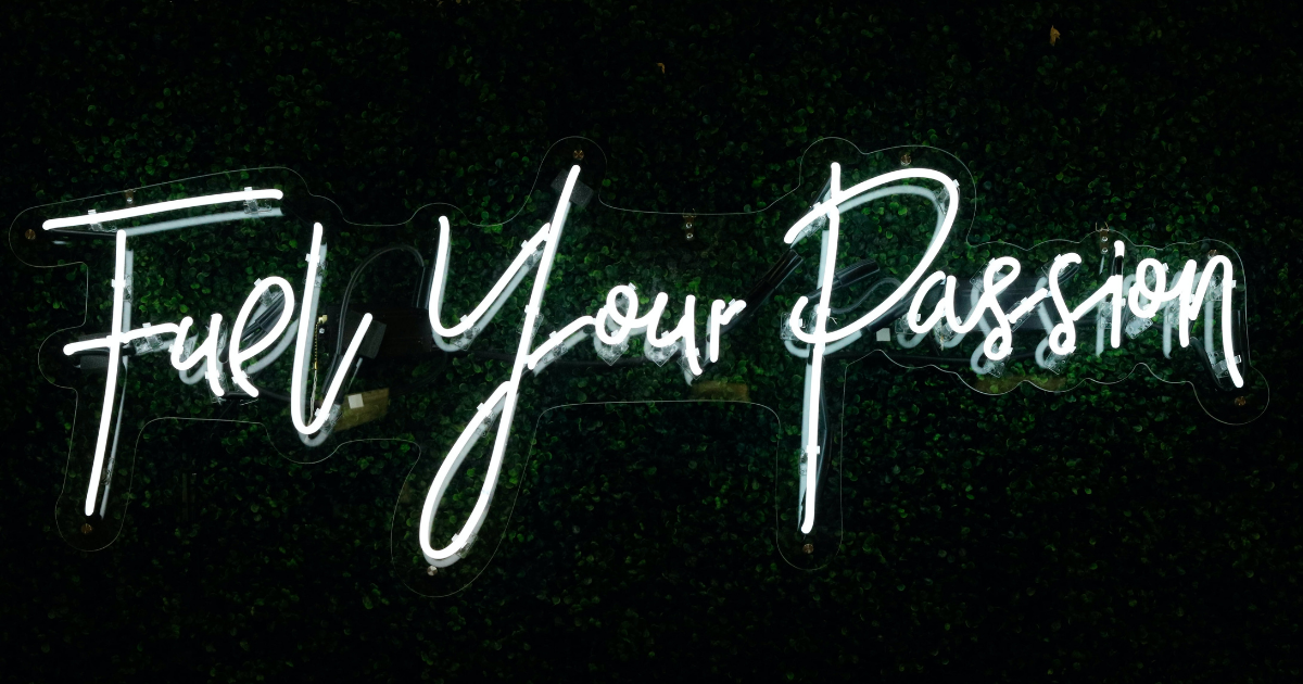 An illuminated sign reading "Fuel Your Passion"