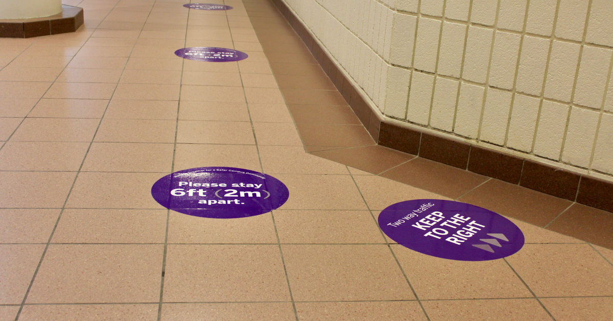 Social distancing signs in the UCC on campus