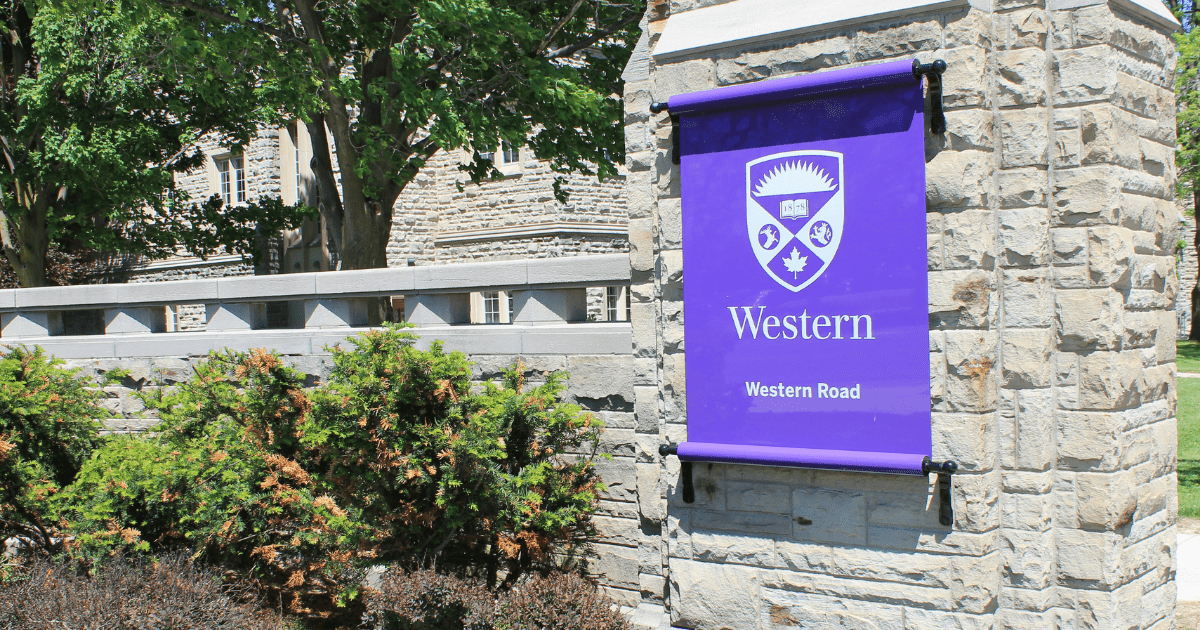 A photo of a Western sign at the main gates of campus