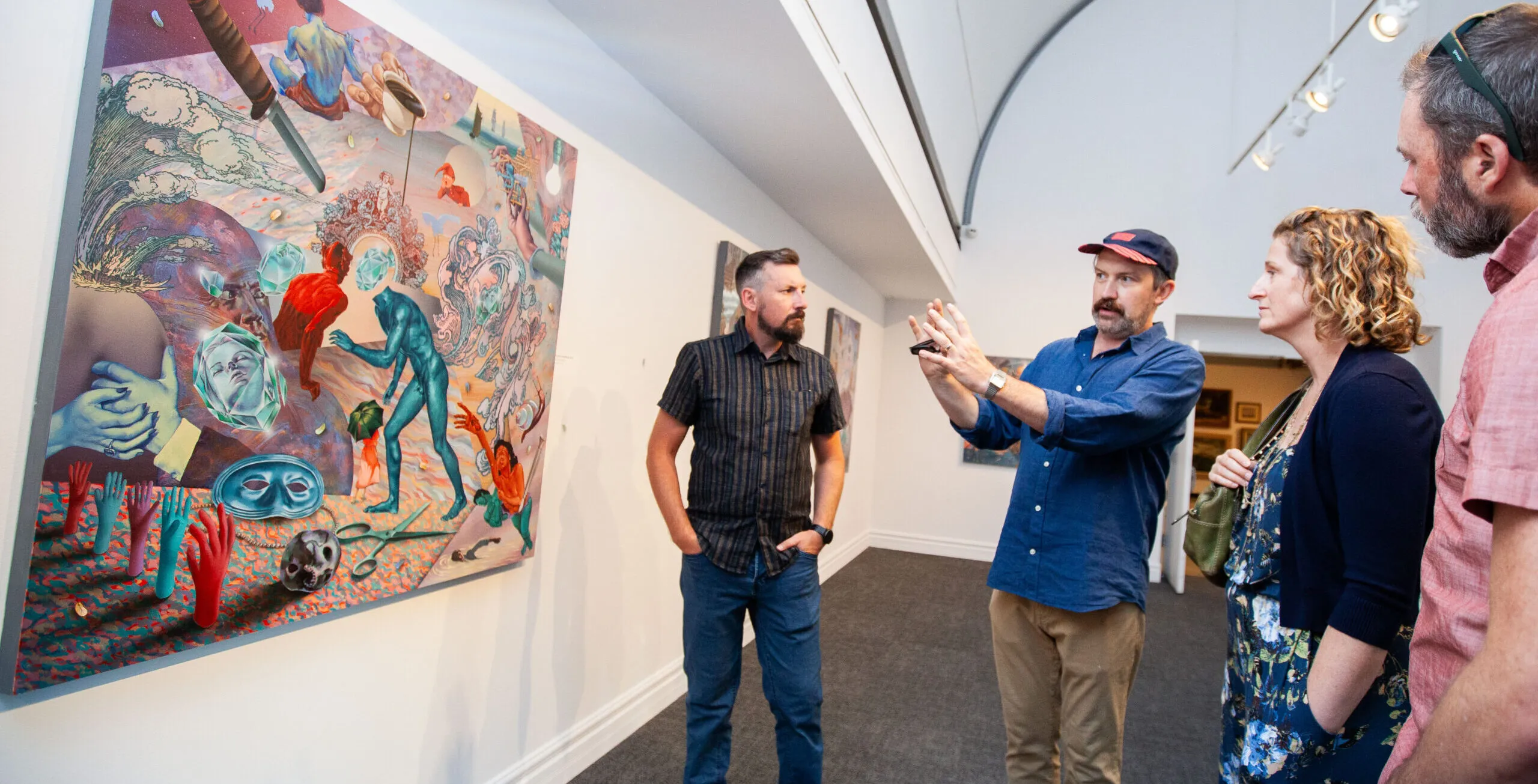 artist pointing to work